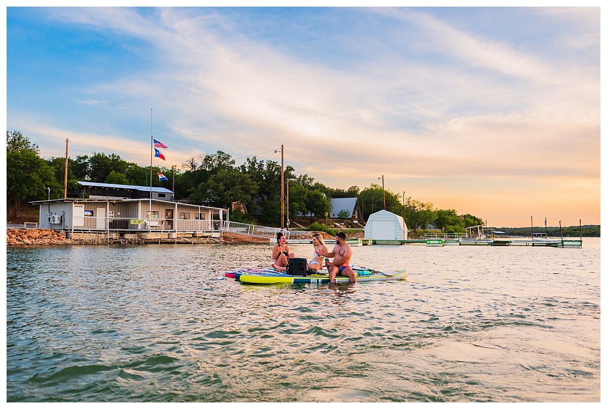 teens floating on lake in summer