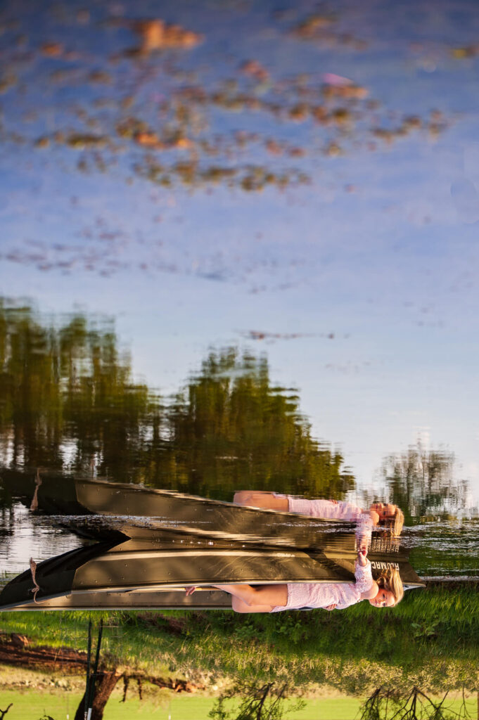 girl in canoe during texas summer photoshoot