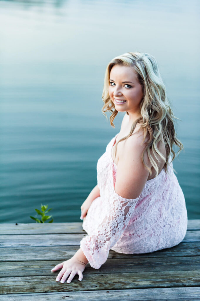 girl in canoe during senior photoshoot in texas