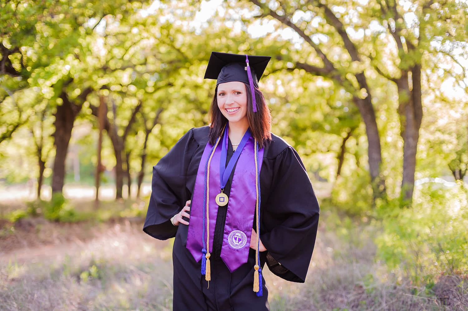 high school senior in cap and gown