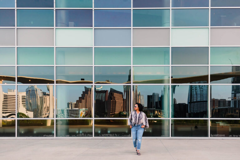 woman entrepreneur walking doing a brand photoshoot at the long center in austin texas