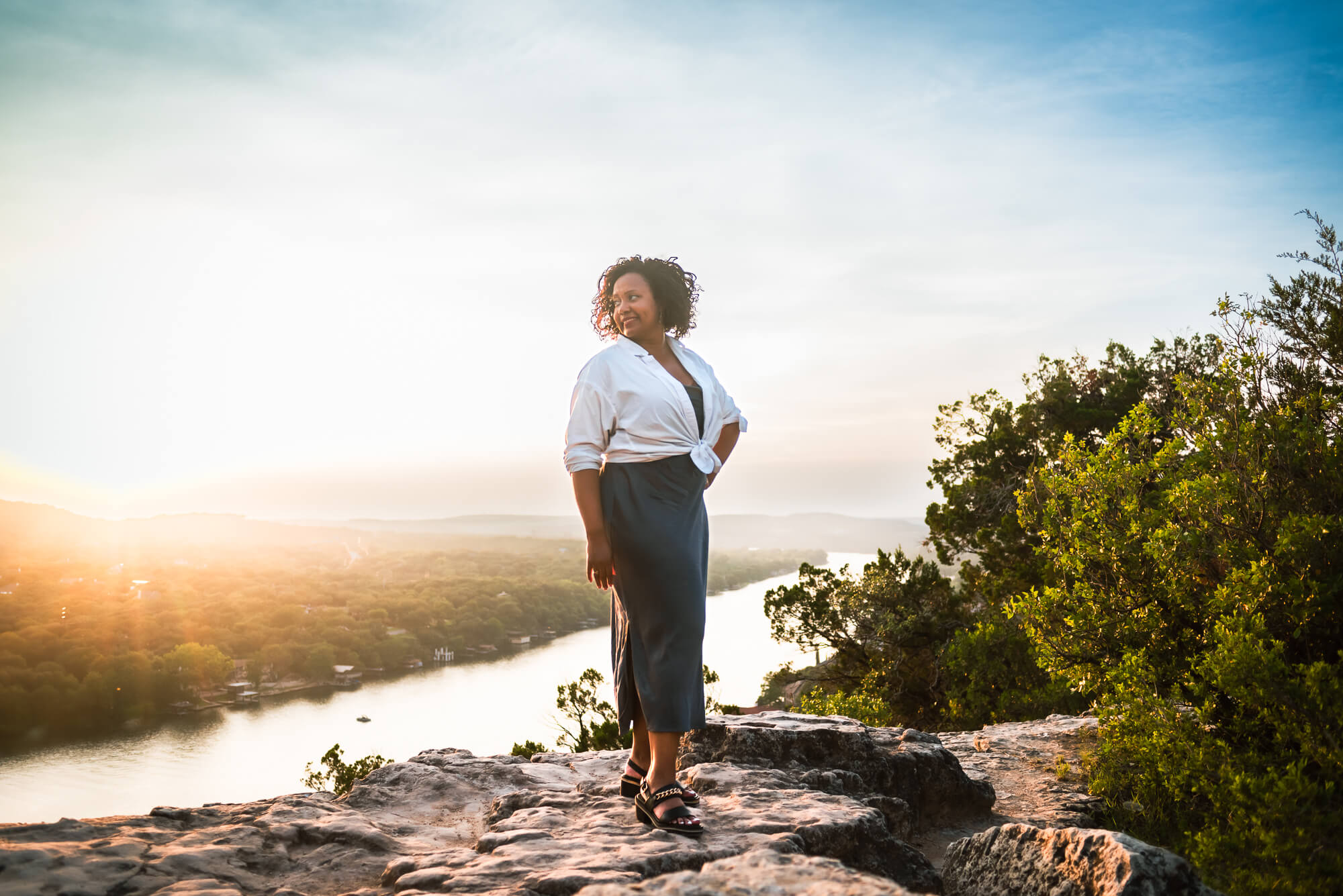 woman standing on top of mount bonnell in austin texas