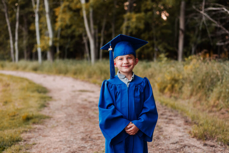 prek boy with cap and gown for graduation
