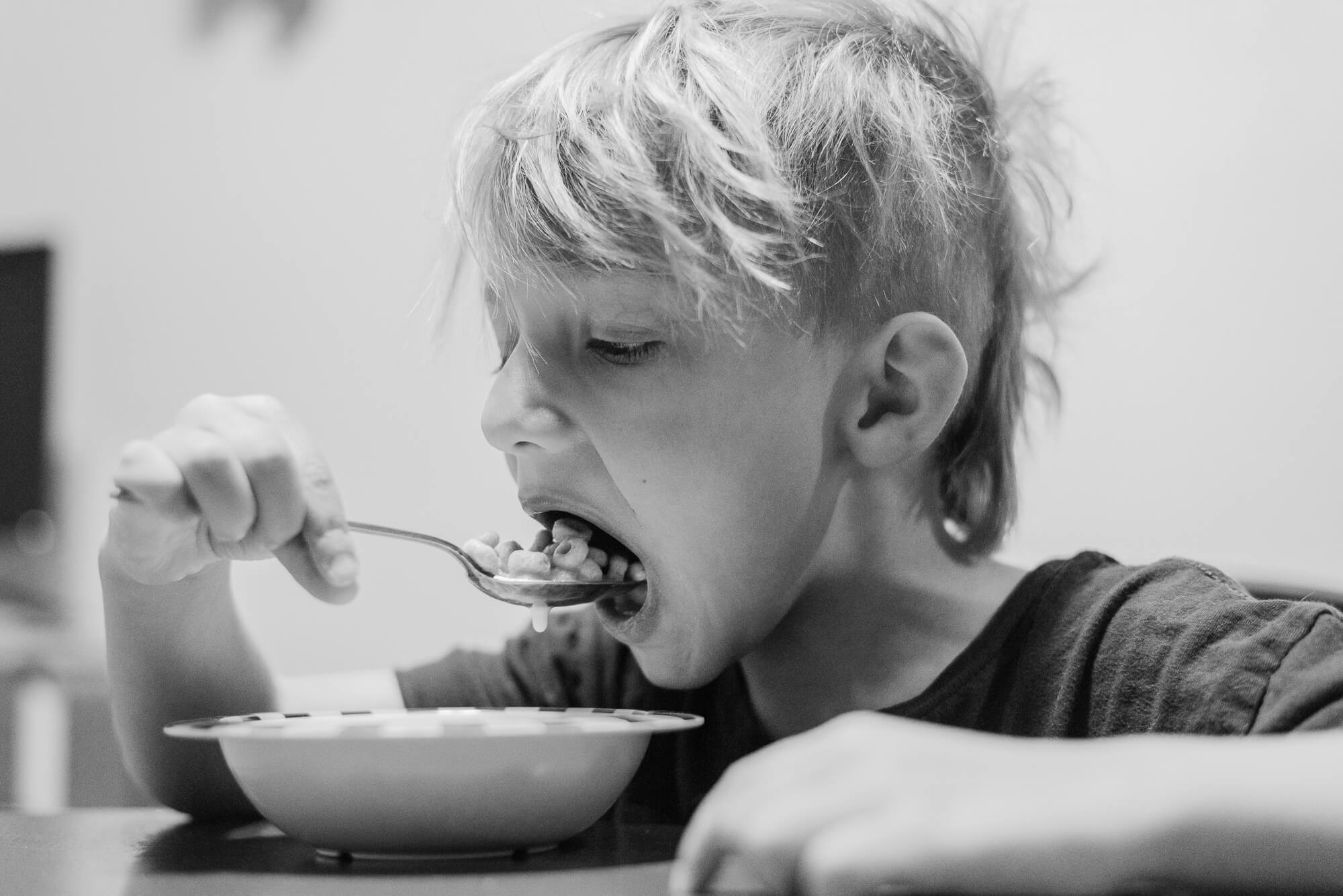 boy eating cereal for breakfast