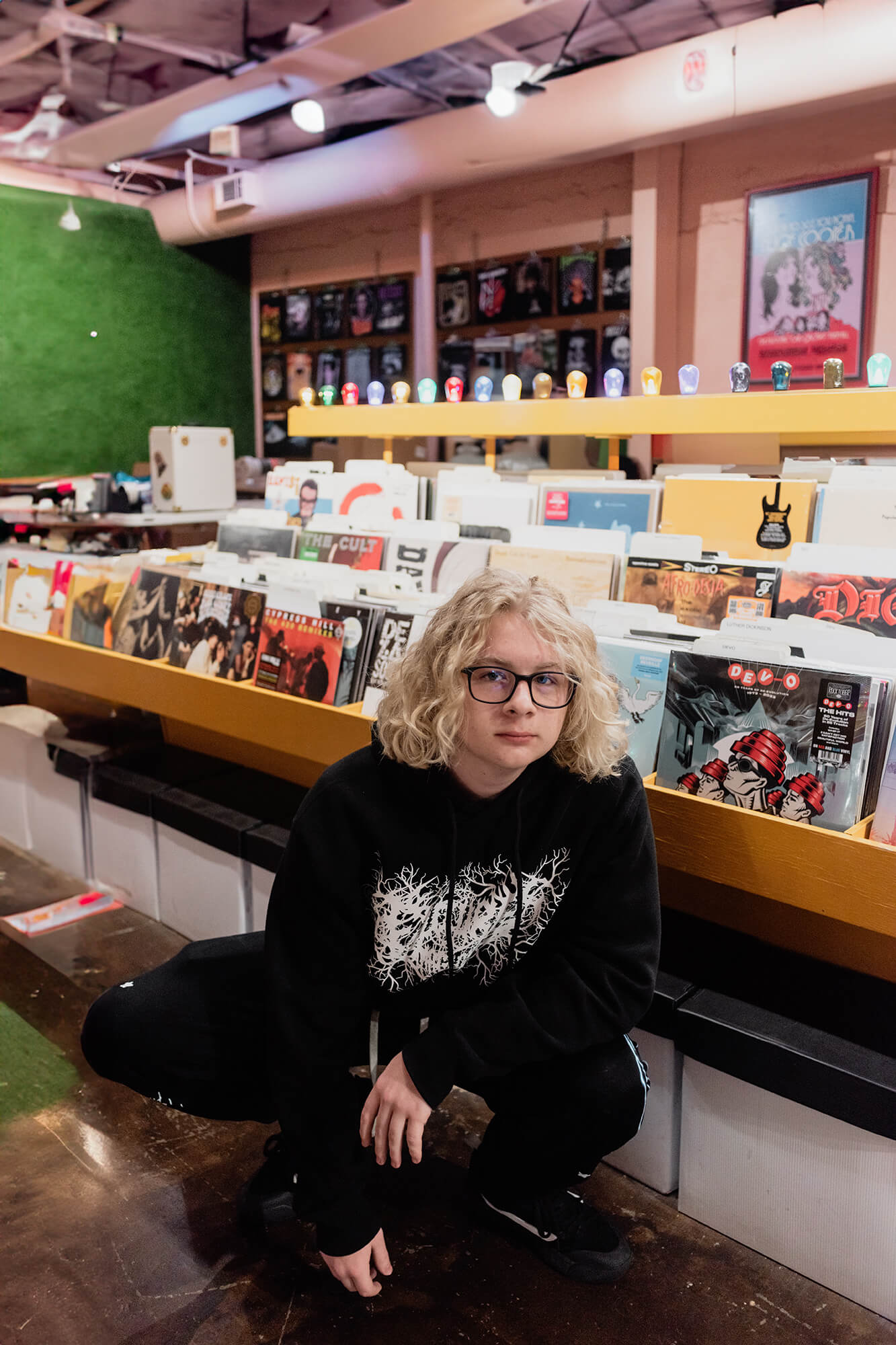 boy posing for senior photos at good records in dallas texas