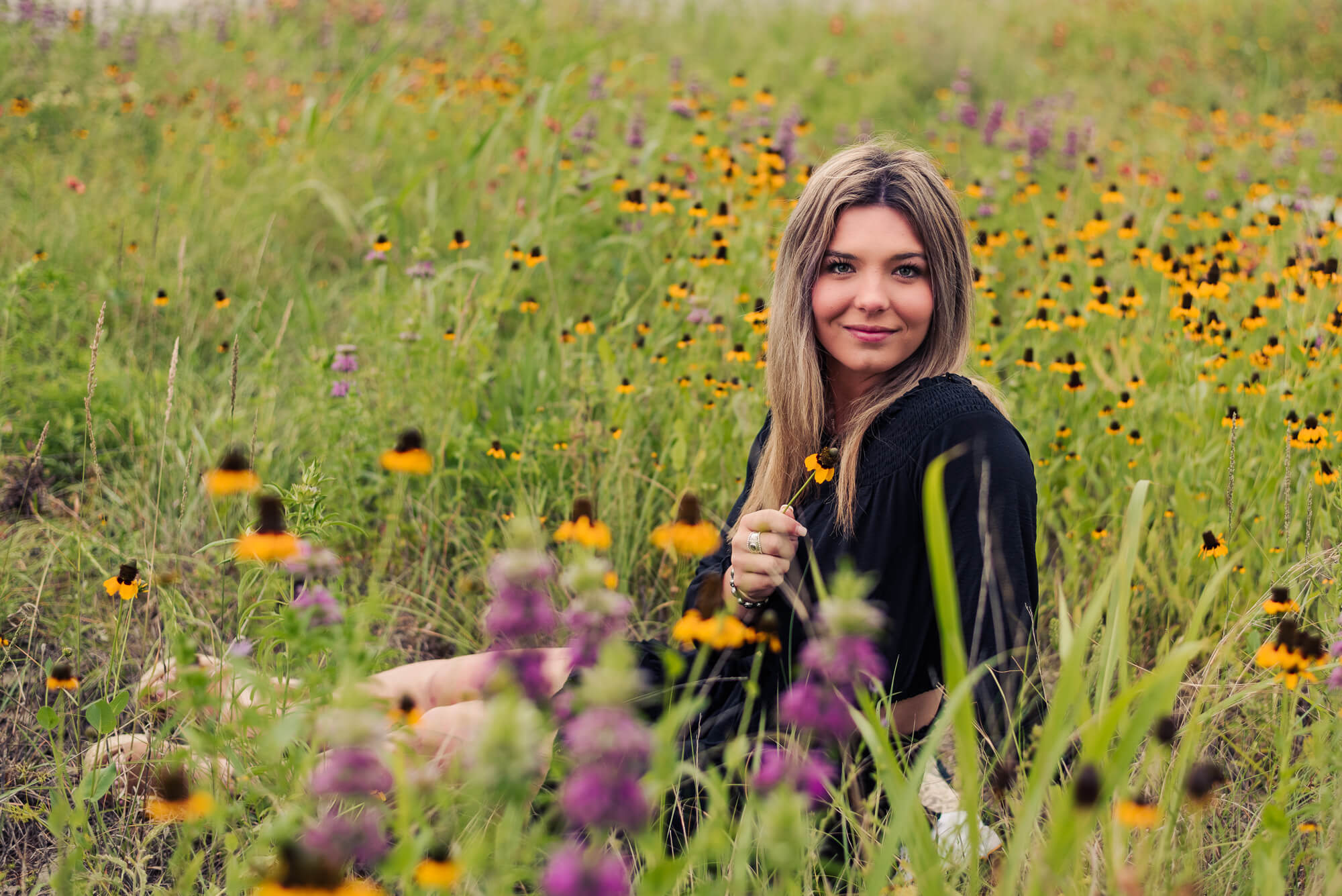 girl in field of flowers for taurus themed zodiac sign photoshoot