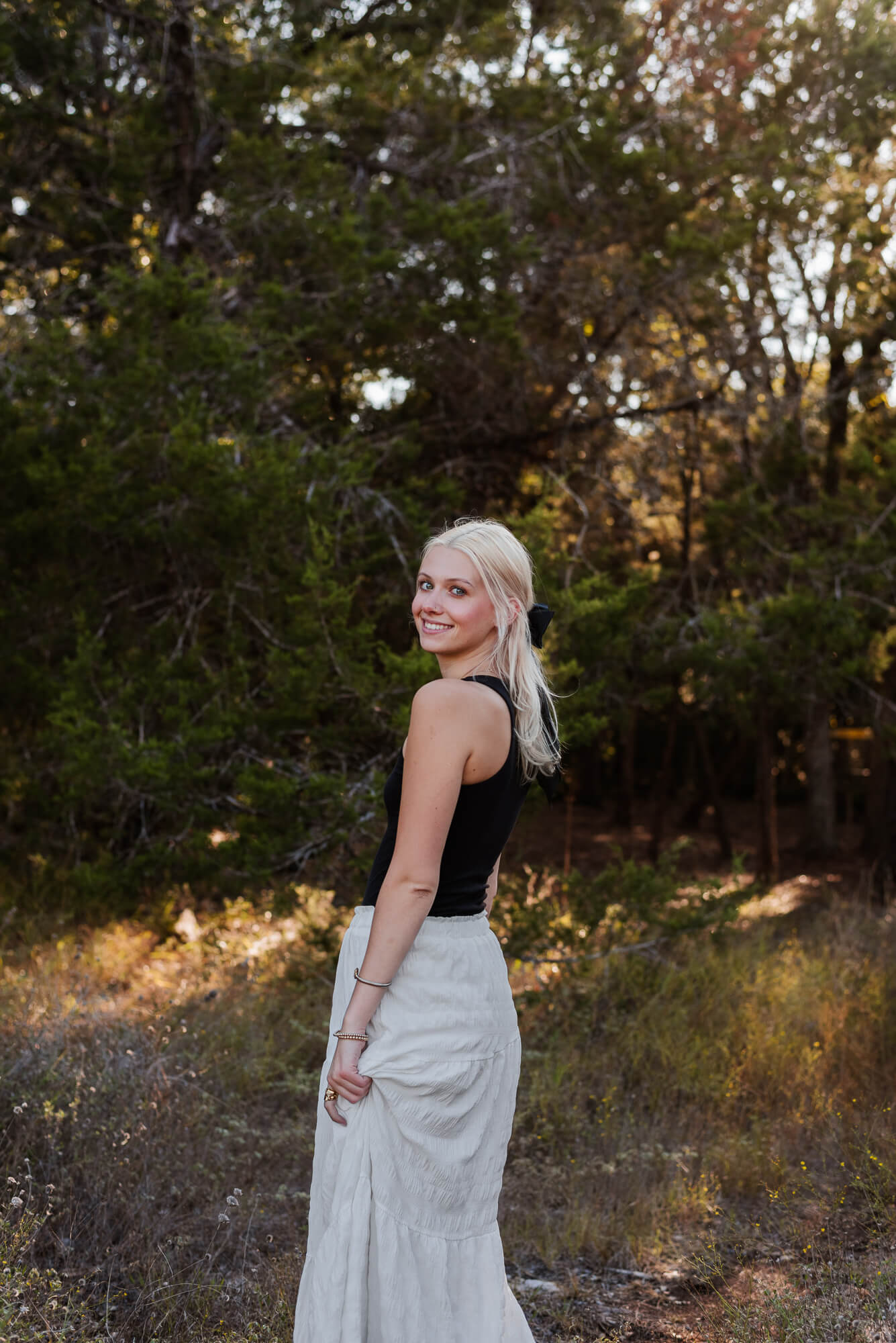 girl smiling at camera during her senior photoshoot