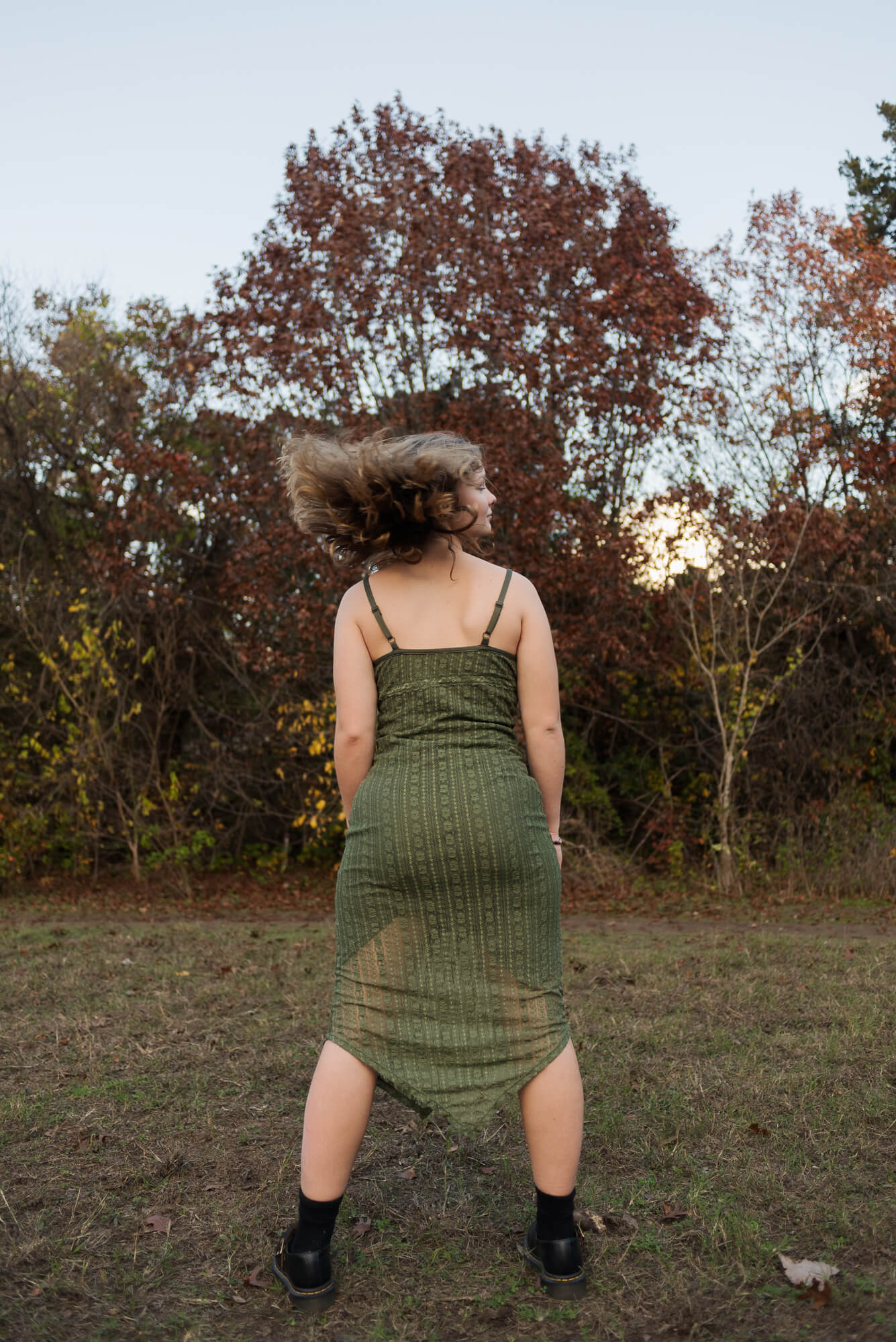 girl flipping hair for senior photo