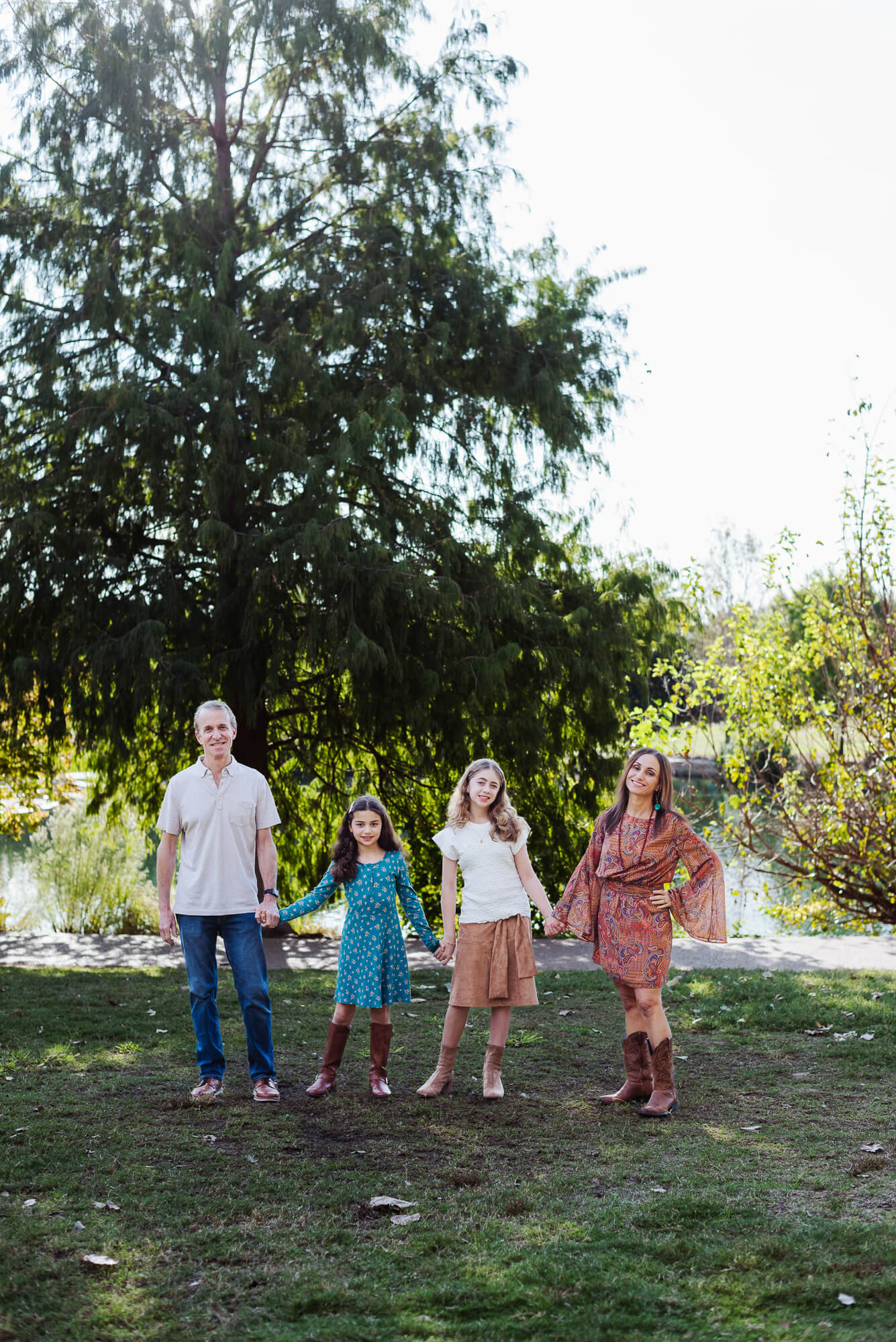 family posing at mueller lake park in austin texas