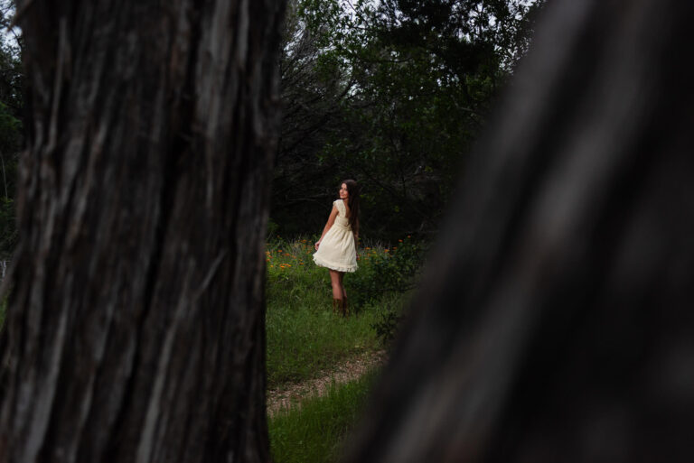 girl twirling for senior photos in austin texas