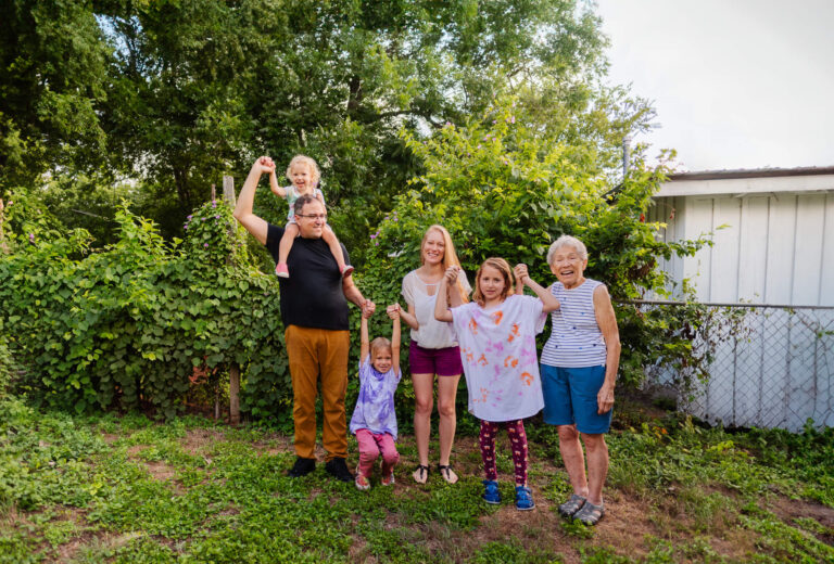 family portrait in family backyard with grandmother who was recently diagnosed with breast cancer