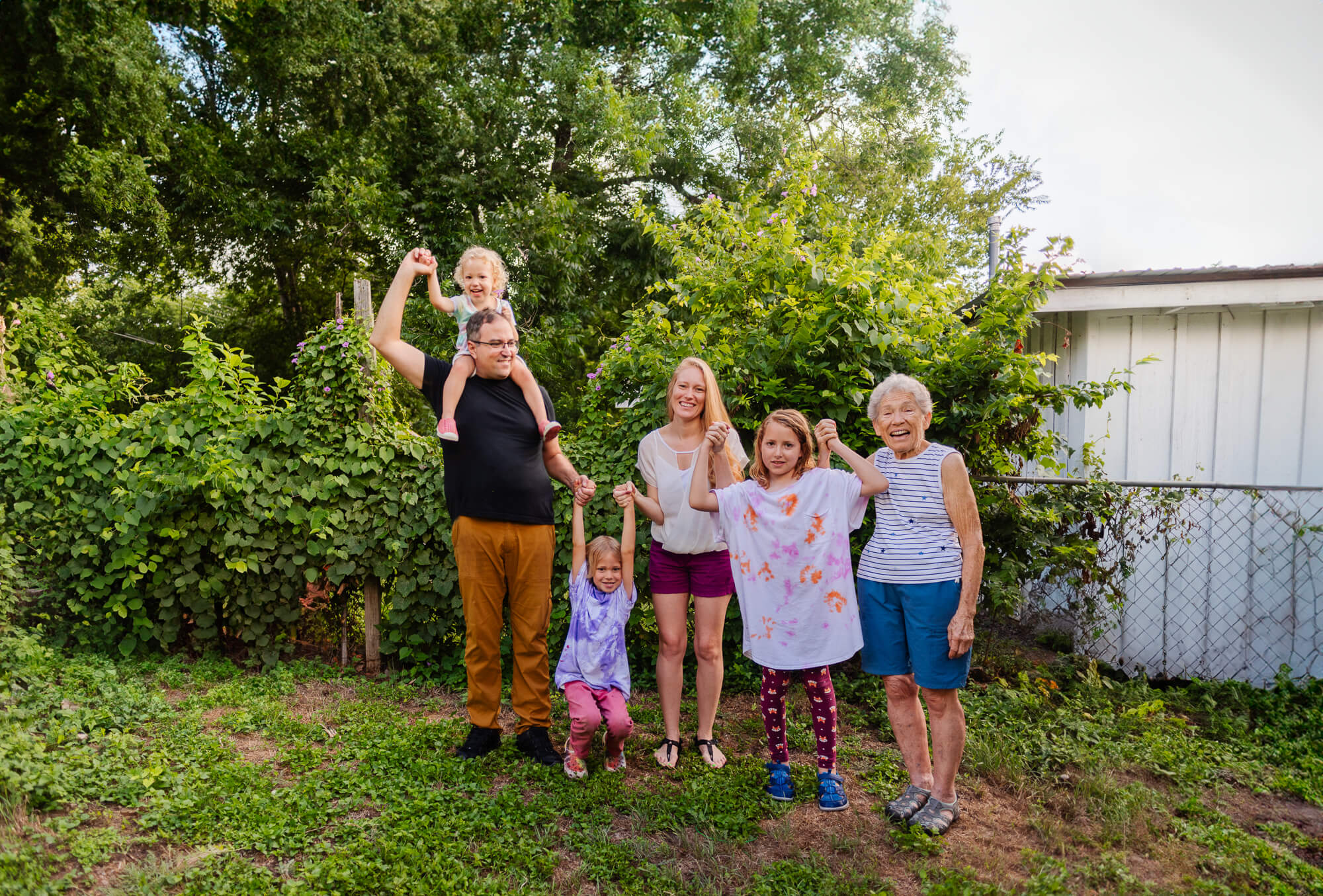 family portrait in family backyard with grandmother who was recently diagnosed with breast cancer
