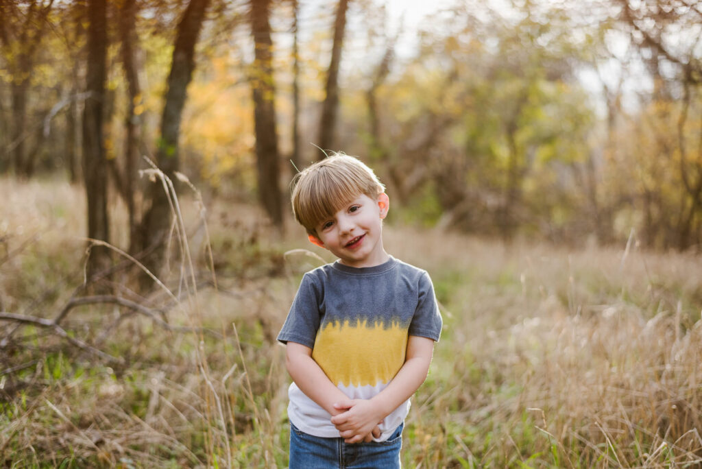little boy during birthday photos at river trail trailhead in austin texas