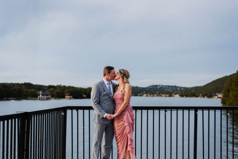 couple kissing during wedding reception at westood country club