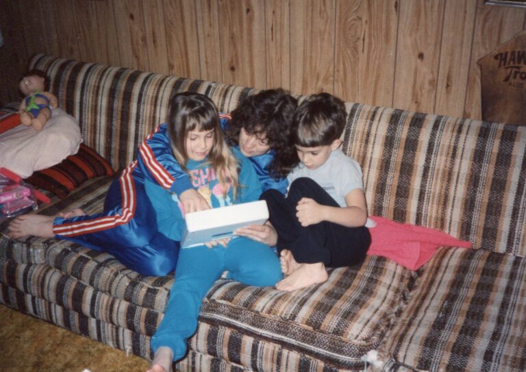 a mom reading to her kids on the couch