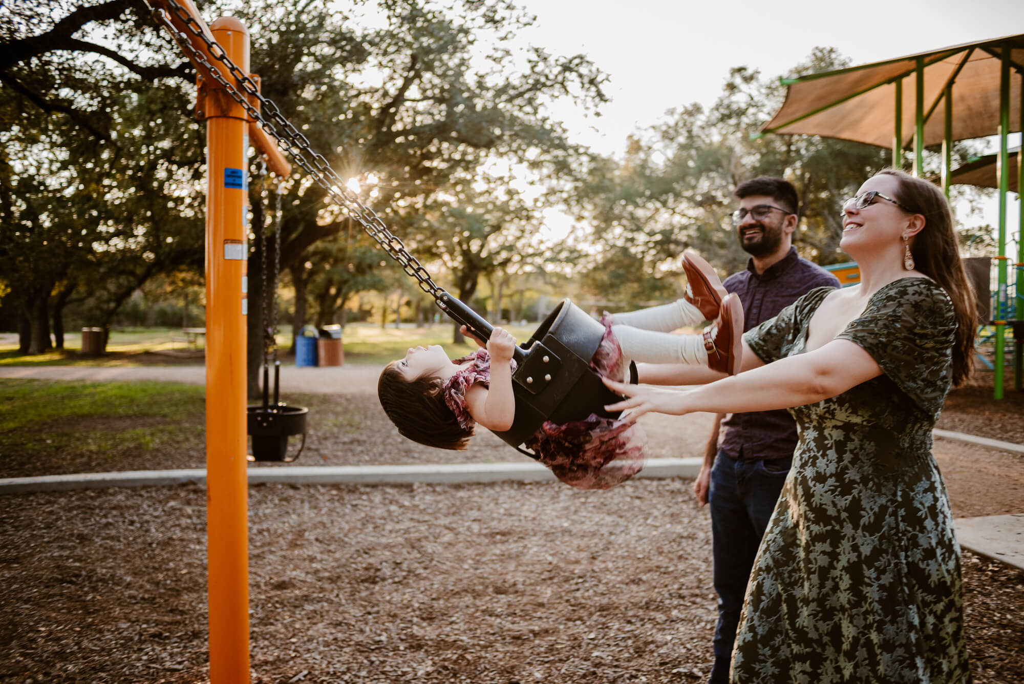 family playing at the park