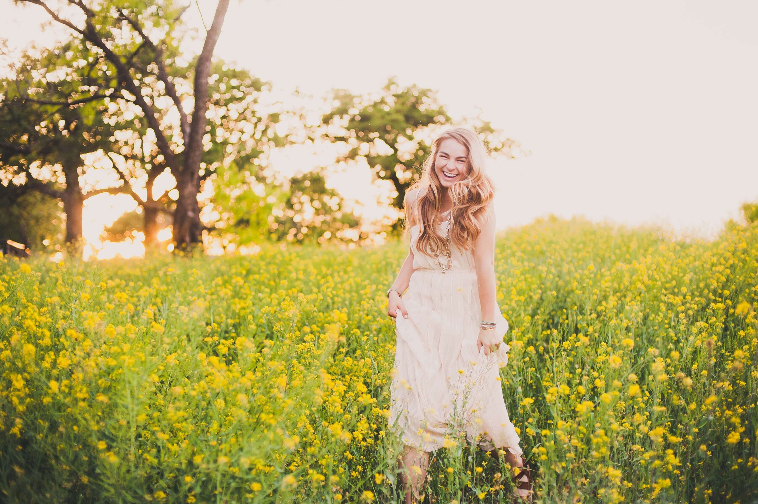 Spring Senior Session in a Field of Yellow Flowers