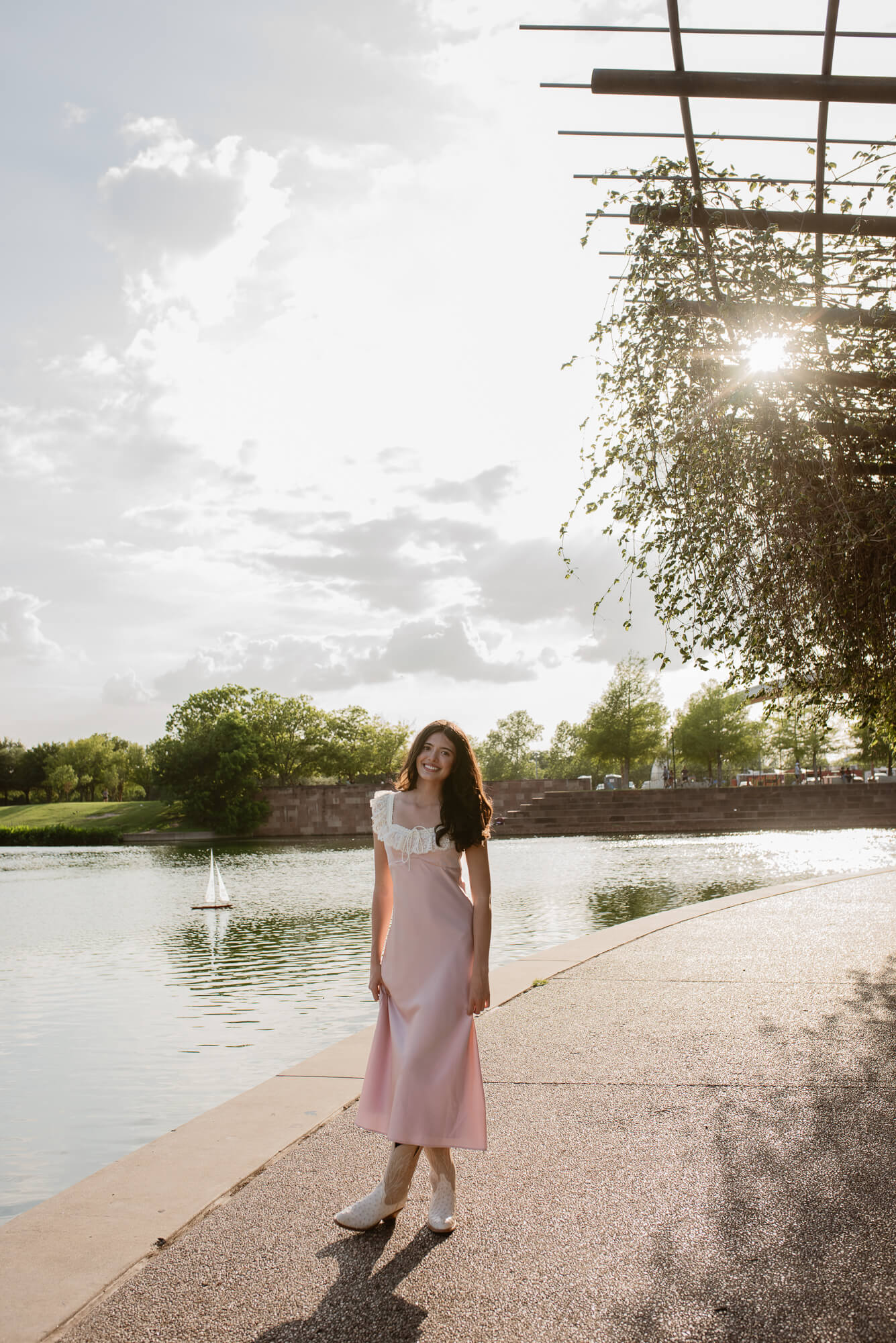 akins high school senior at mueller lake park walking towards camera