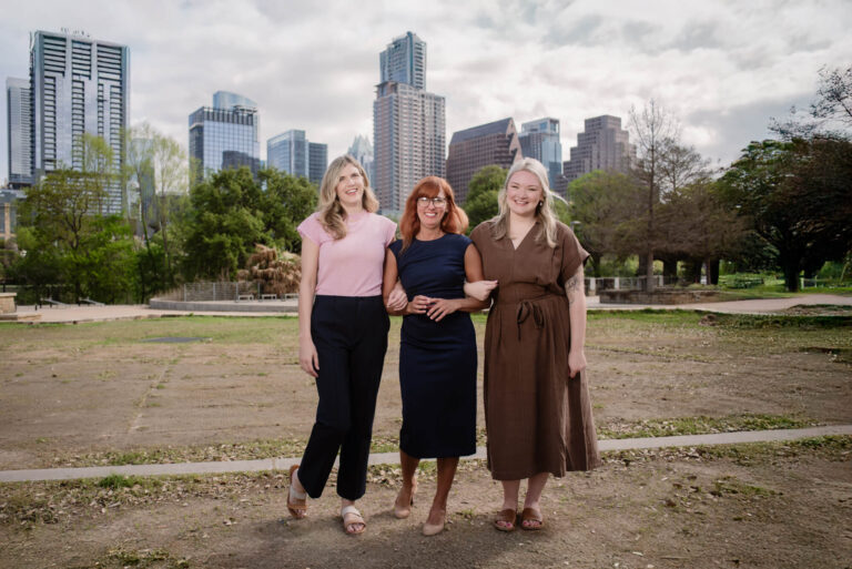 Therapists from Vida Clinic with downtown Austin Skyline in the background
