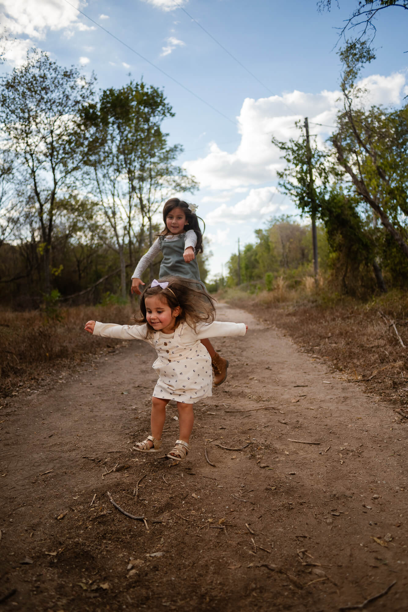 Toddler warming up to the camera during a family photo session