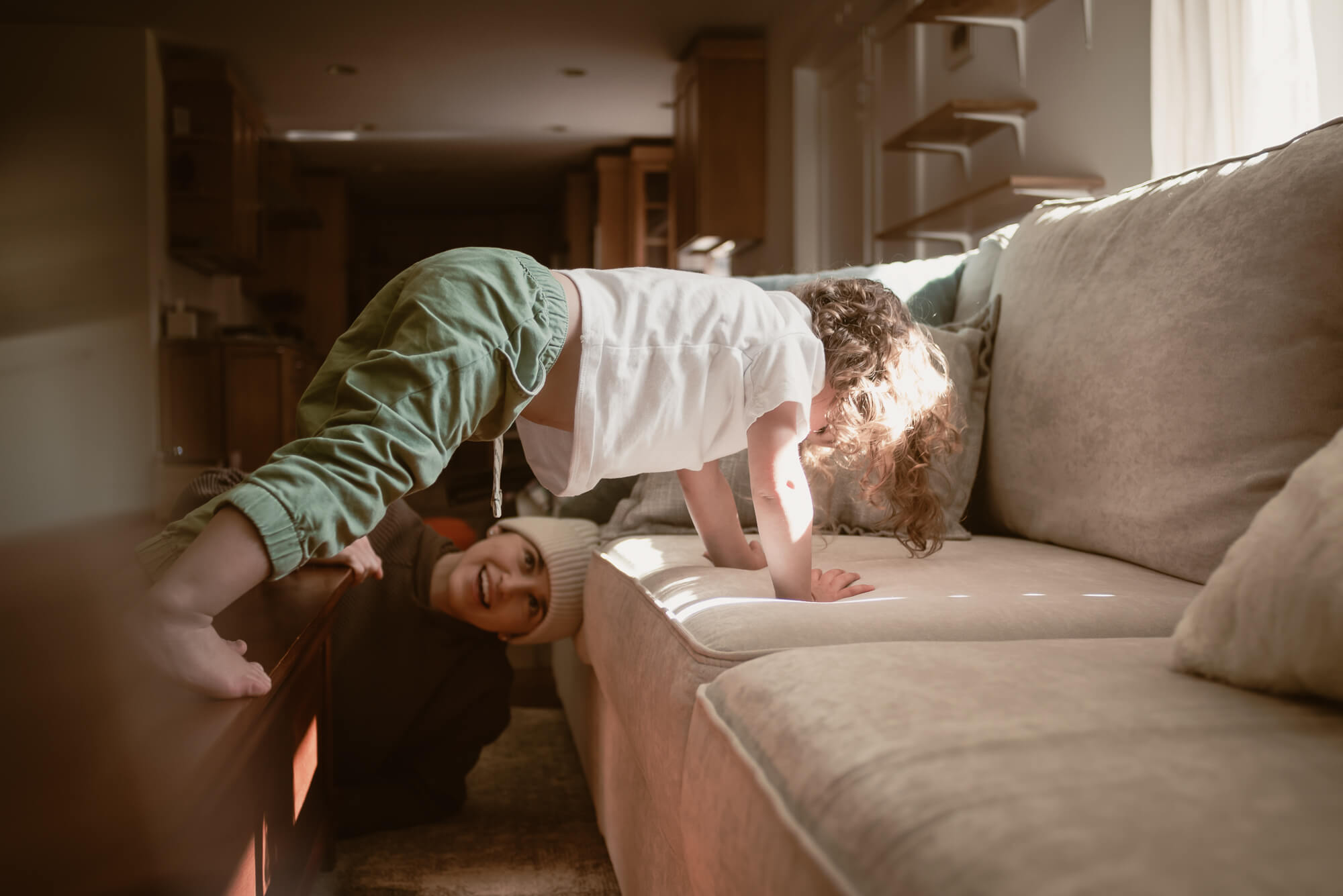 parent playing with their toddler during their indoor family photoshoot